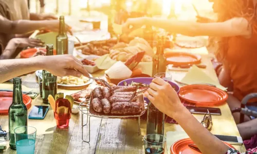 Group of friends eating around a table